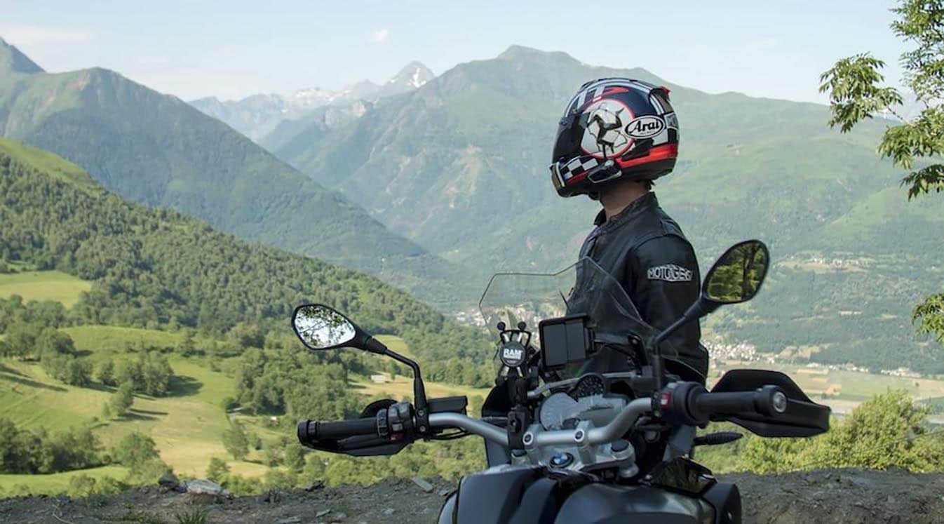 motorcyclist wearing white helmet