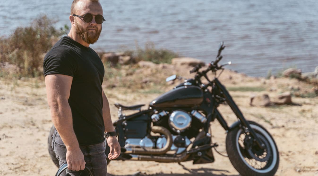 Man posing with motorcycle