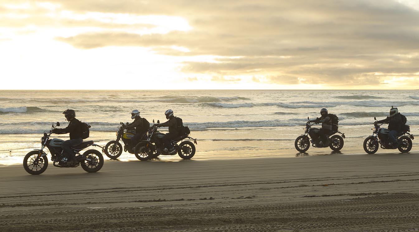 bikers riding on beach